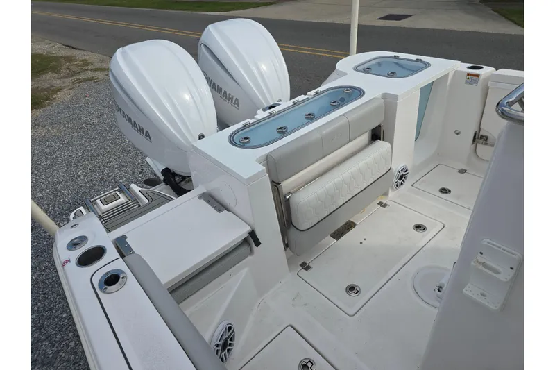 Slide: The Image of 2023 Sea Fox 288 Commander boat with Yamaha engines, featuring a spacious deck and seating area. - 8