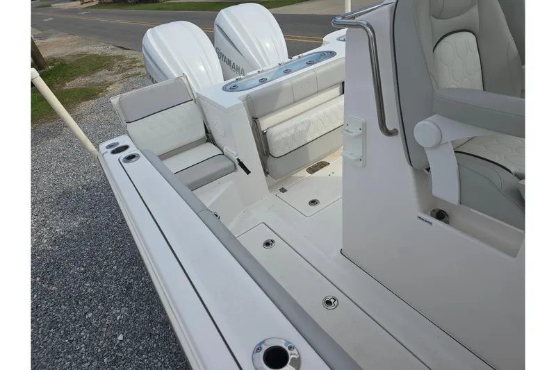 Slide: The Image of 2023 Sea Fox 288 Commander boat interior with seating and dual Yamaha engines. - 9