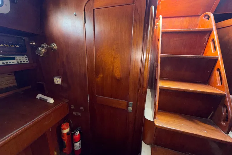 Slide: The Image of 1983 Morgan Catilina yacht interior with wooden stairs and navigation equipment. - 122