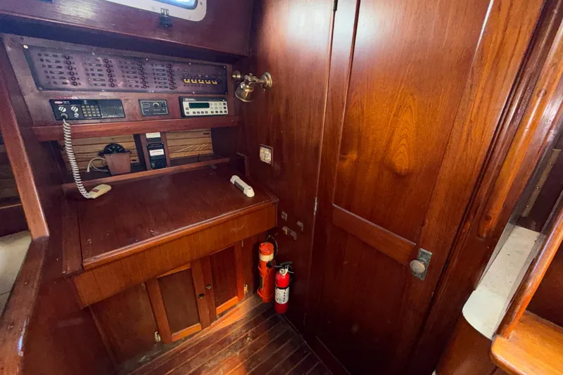 Slide: The Image of 1983 Morgan Catilina yacht interior with navigation equipment and wooden cabinetry. - 123