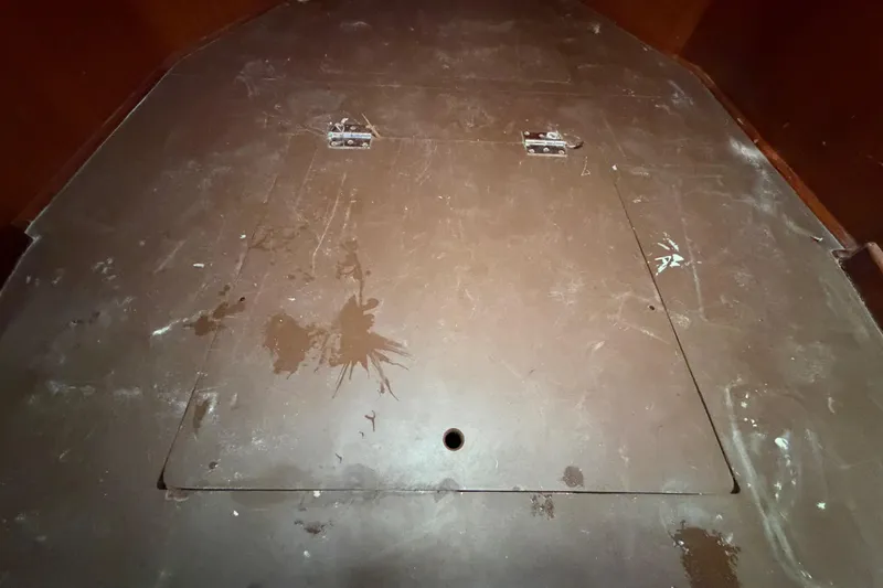 Slide: The Image of 1983 Morgan Catilina interior with a hinged wooden panel and visible wear marks. - 154