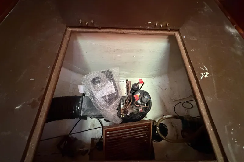 Slide: The Image of 1983 Morgan Catilina engine compartment with mechanical components and wiring. - 155