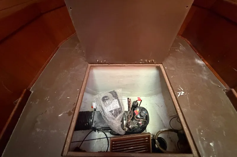 Slide: The Image of Engine compartment of a 1983 Morgan Catilina boat, showing machinery and wiring. - 156