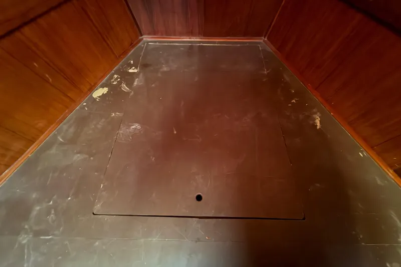 Slide: The Image of Wooden interior of a 1983 Morgan Catilina, featuring a hatch on the floor. - 158