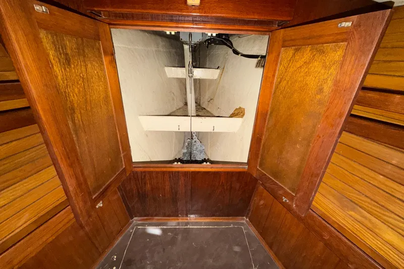 Slide: The Image of 1983 Morgan Catilina interior with wooden cabinetry and storage space. - 159