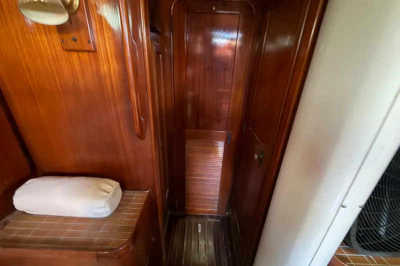 Slide: The Image of 1983 Morgan Catilina yacht interior with wooden paneling and cozy cabin space. - 173