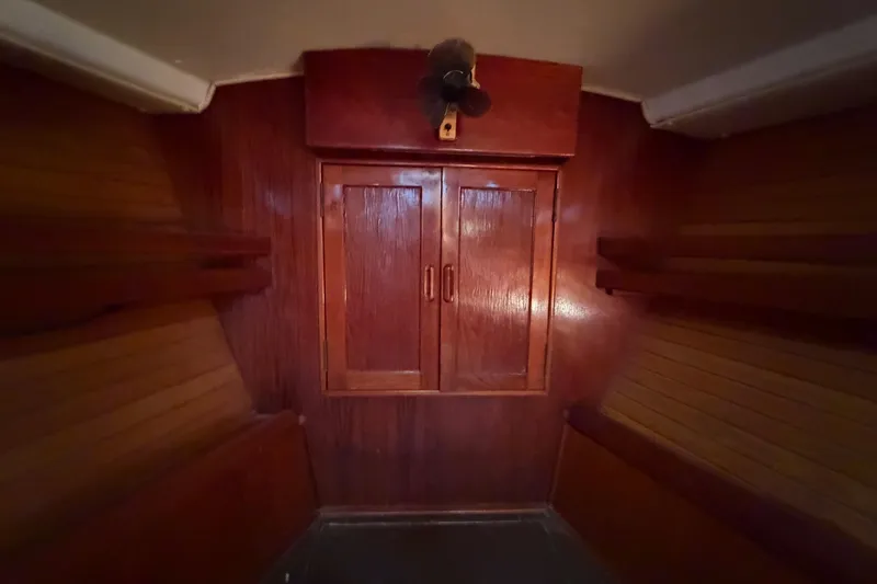 Slide: The Image of Interior of 1983 Morgan Catilina boat with wooden cabinetry and shelving. - 183