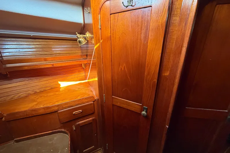 Slide: The Image of Wooden interior of a 1983 Morgan Catilina boat with warm lighting. - 193