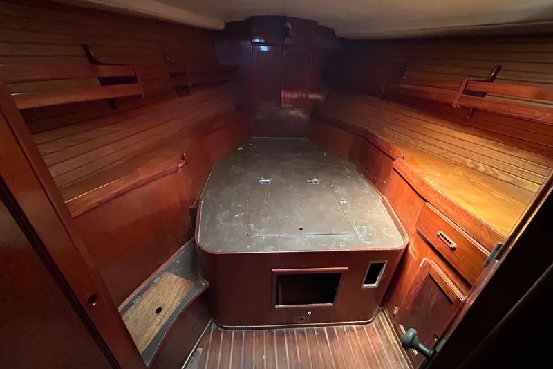 Slide: The Image of Interior of 1983 Morgan 45 Catalina sailboat with wooden cabinetry and spacious layout. - 201