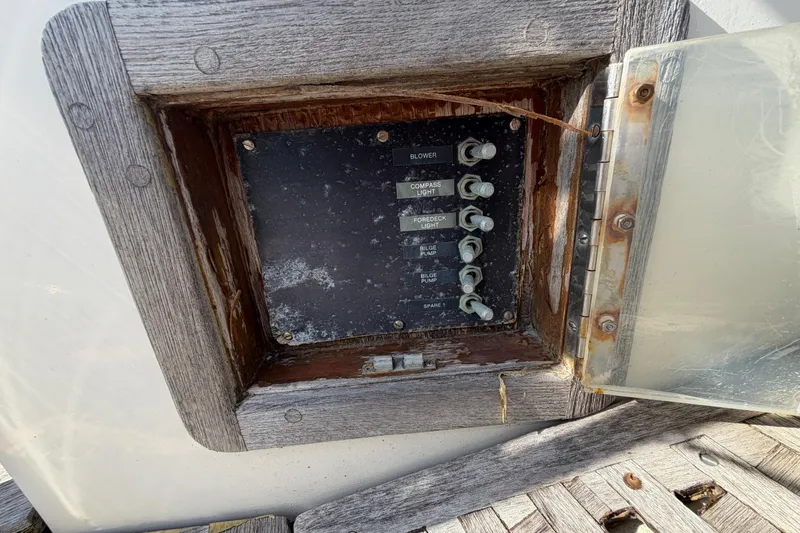 Slide: The Image of Control panel on a 1983 Morgan Catilina boat with switches for various functions. - 24