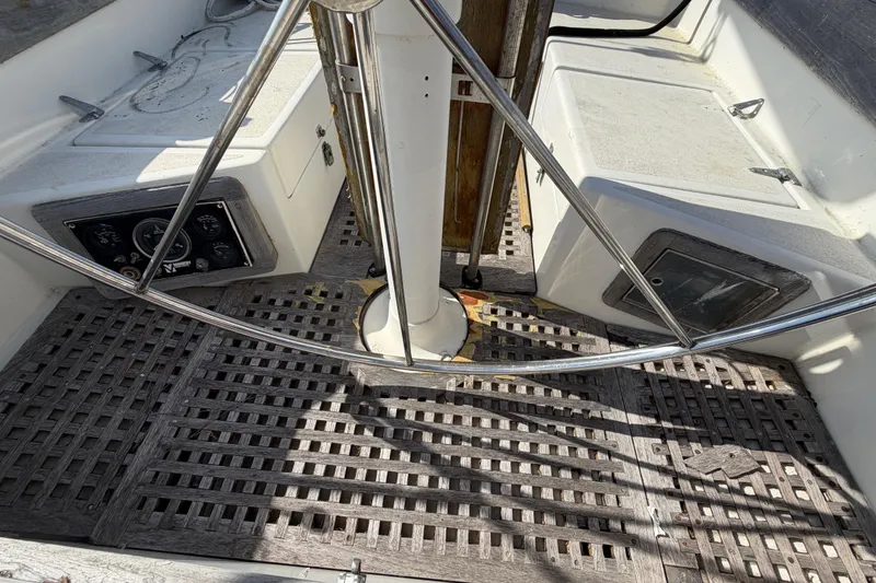 Slide: The Image of Cockpit of 1983 Morgan Catilina sailboat with wooden flooring and steering wheel. - 26