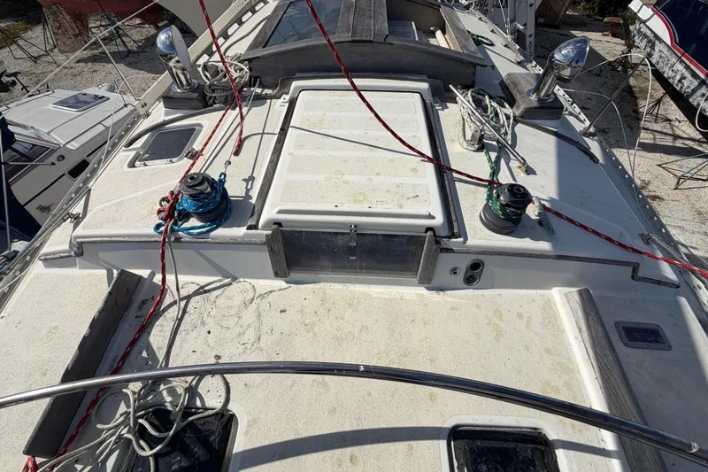 Slide: The Image of 1983 Morgan Catilina sailboat deck with ropes and winches, viewed from above. - 29