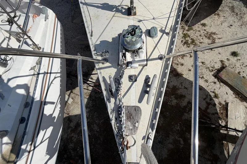 Slide: The Image of Bow of 1983 Morgan Catilina sailboat with anchor chain and deck fittings. - 40