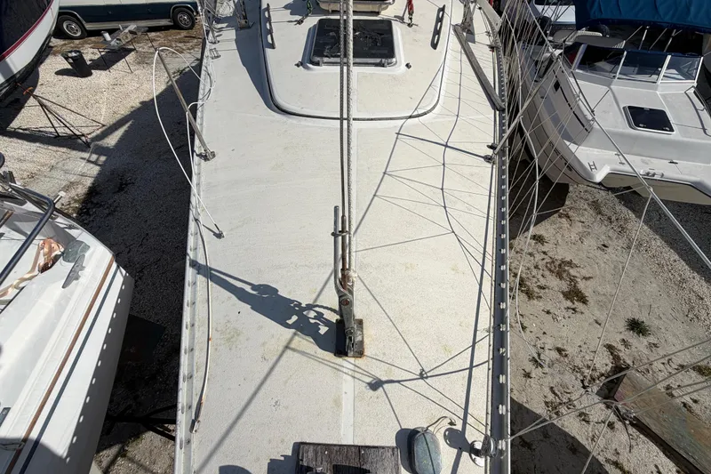 Slide: The Image of 1983 Morgan Catilina sailboat deck view, docked with surrounding boats. - 42