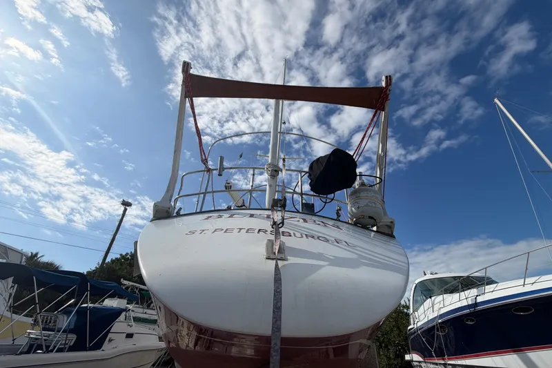 Slide: The Image of 1983 Morgan Catilina sailboat in St. Petersburg, Florida, under a clear blue sky. - 5