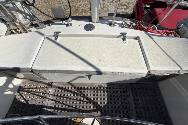 Slide: The Image of 1983 Morgan Catilina boat deck with storage compartments and railing. - 61