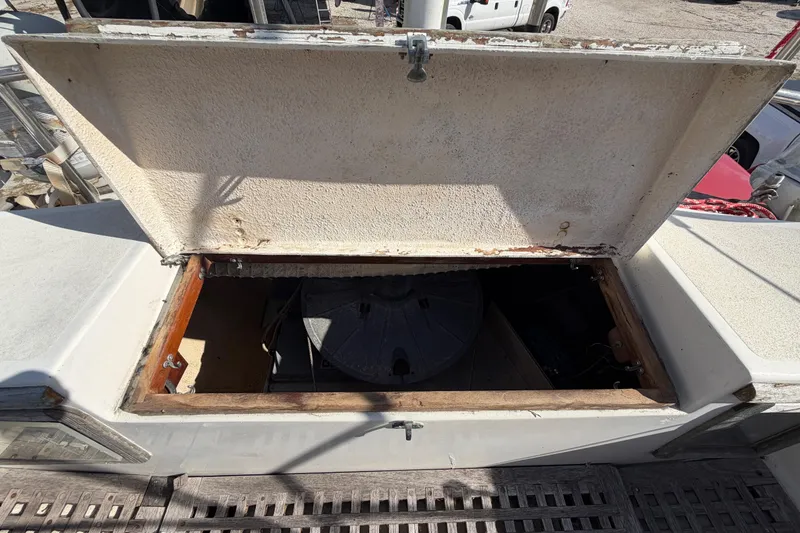 Slide: The Image of Open hatch on 1983 Morgan Catilina boat, revealing interior storage compartment. - 62