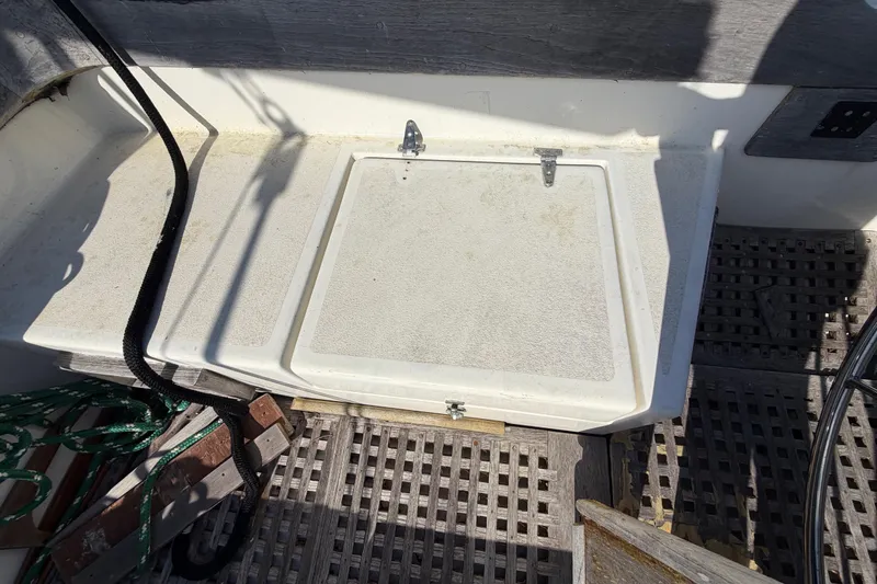 Slide: The Image of 1983 Morgan Catilina boat deck with storage hatch and nautical equipment. - 64