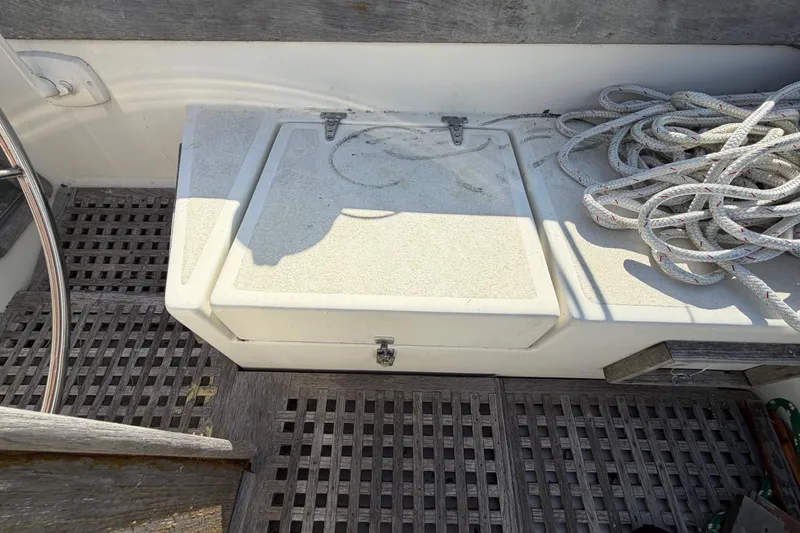 Slide: The Image of 1983 Morgan Catilina boat interior with storage compartment and coiled ropes. - 67