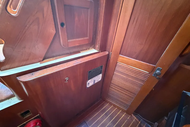 Slide: The Image of 1983 Morgan Catilina interior with wooden paneling and storage compartments. - 95