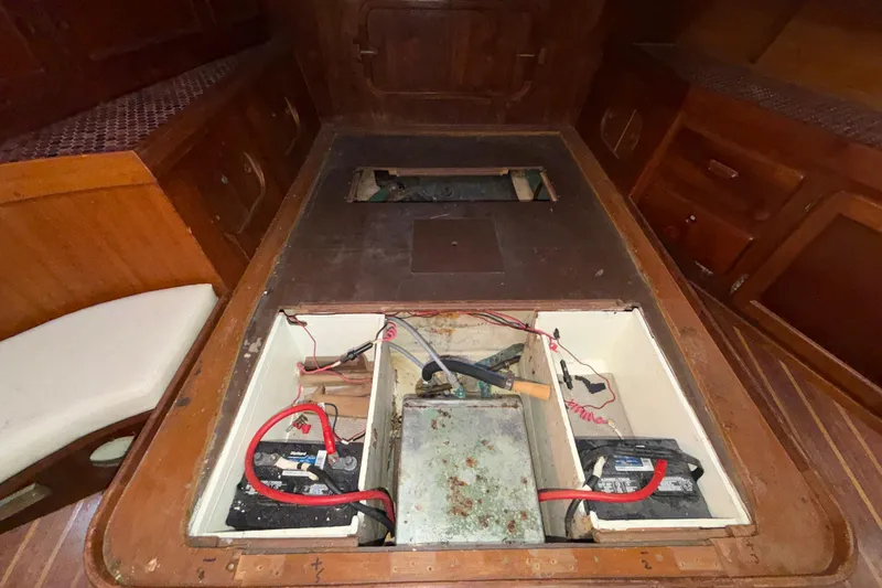 Slide: The Image of Interior of 1983 Morgan Catilina showing battery compartment and wooden cabinetry. - 97