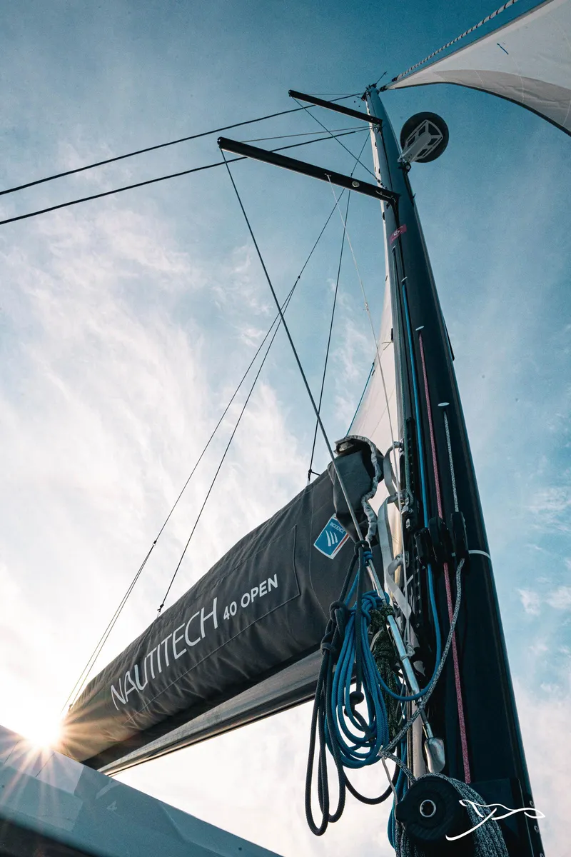 Slide: The Image of 2025 Nautitech 40 Open sailboat mast against a clear blue sky. - 12