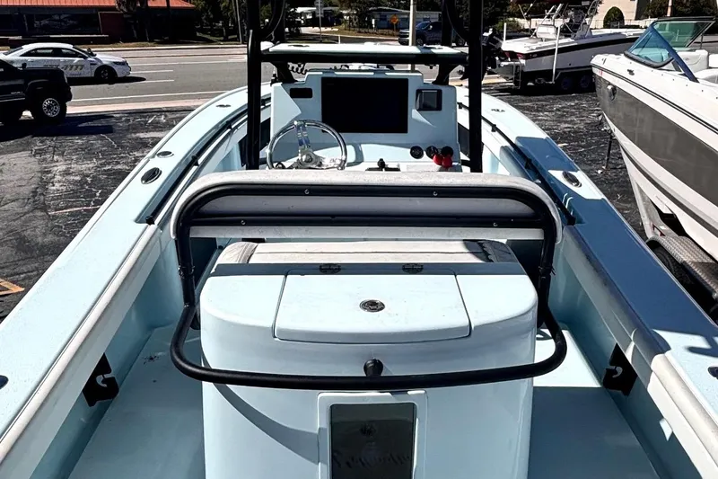 Slide: The Image of 2021 Yellowfin 26 Hybrid boat interior with steering console and seating. - 10