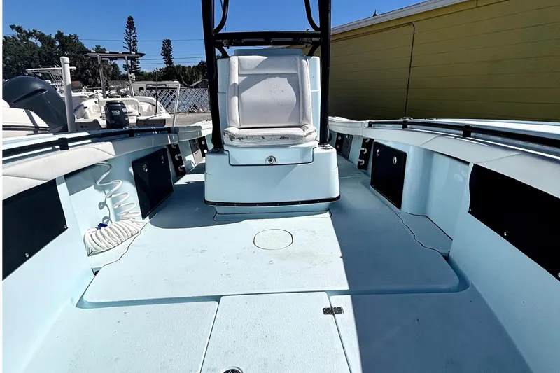 Slide: The Image of 2021 Yellowfin 26 Hybrid boat interior with seating and storage compartments. - 17
