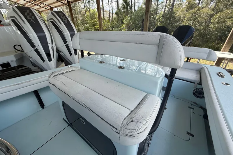 Slide: The Image of 2021 Yellowfin 26 Hybrid boat interior with dual 300R engines and seating. - 18