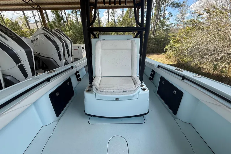 Slide: The Image of 2021 Yellowfin 26 Hybrid boat interior with seating and powerful engines. - 19