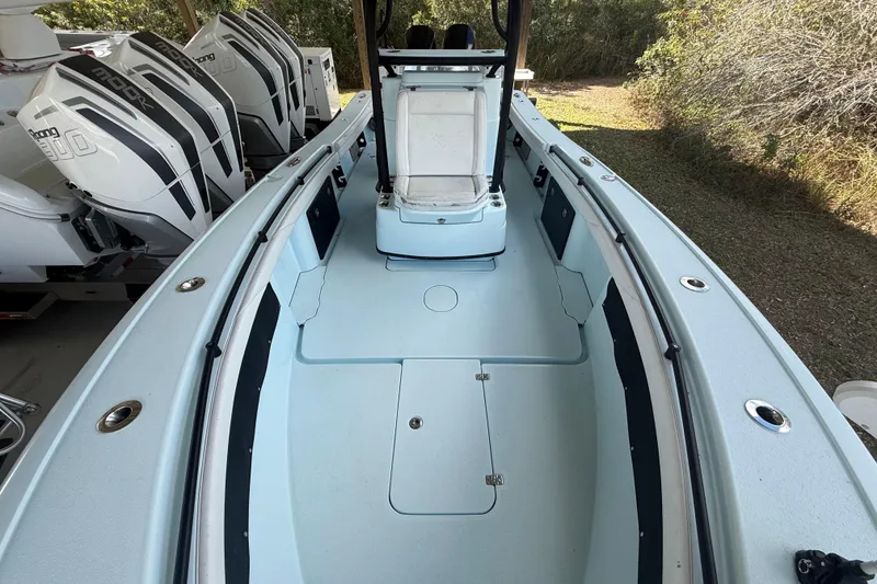 Slide: The Image of 2021 Yellowfin 26 Hybrid boat interior with spacious deck and powerful engines. - 22
