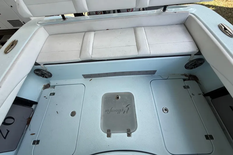 Slide: The Image of 2021 Yellowfin 26 Hybrid boat interior with seating and storage compartments. - 29