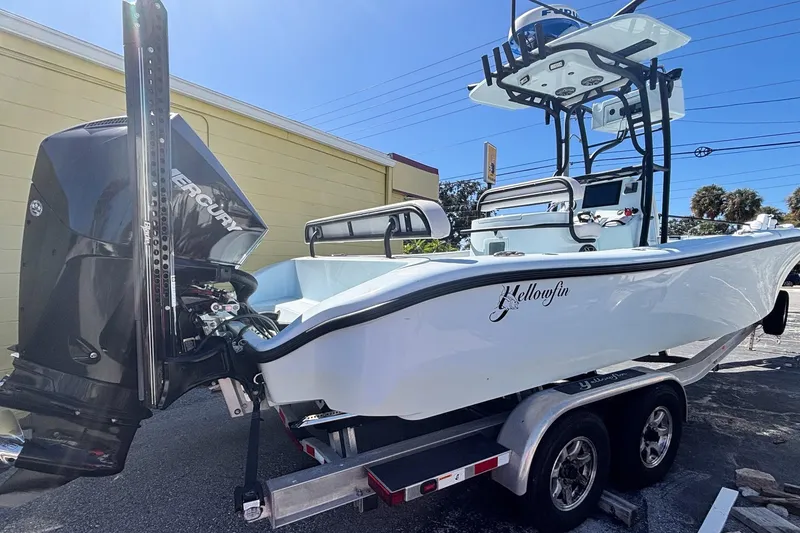 Slide: The Image of 2021 Yellowfin 26 Hybrid boat on trailer with Mercury engine. - 3