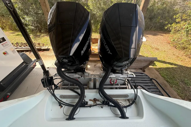 Slide: The Image of 2021 Yellowfin 26 Hybrid boat with dual Mercury outboard engines. - 30