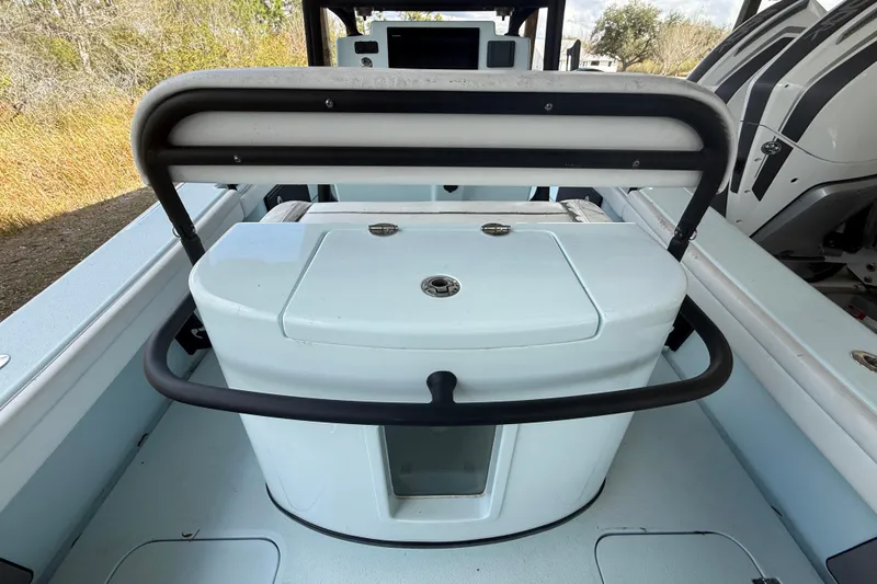 Slide: The Image of 2021 Yellowfin 26 Hybrid boat interior with seating and storage. - 32
