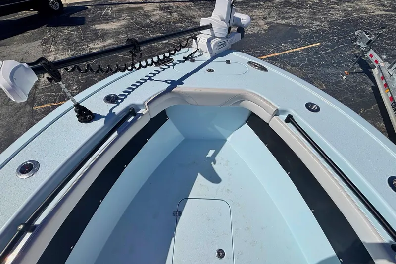 Slide: The Image of 2021 Yellowfin 26 Hybrid boat bow with trolling motor and spacious deck. - 7