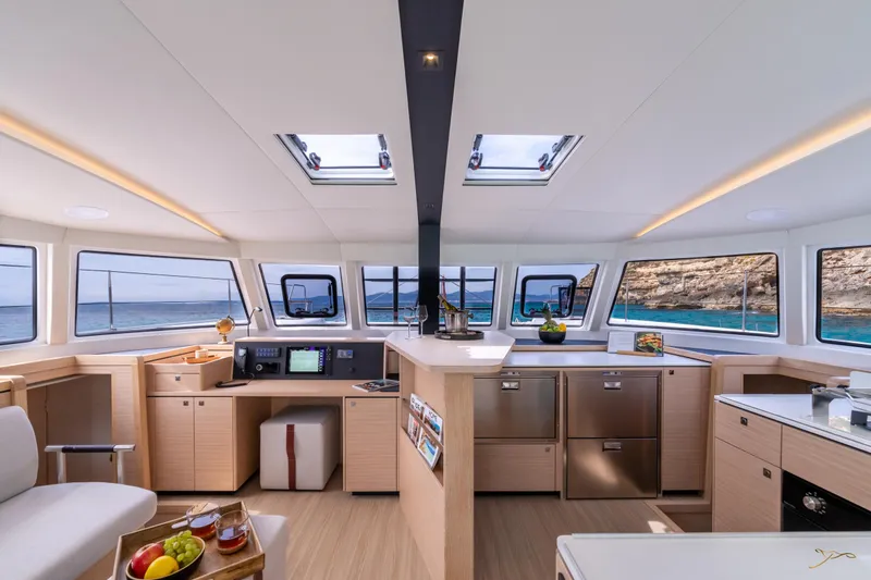 Slide: The Image of Luxurious interior of 2025 Nautitech 44 Open catamaran with modern kitchen and panoramic windows. - 30