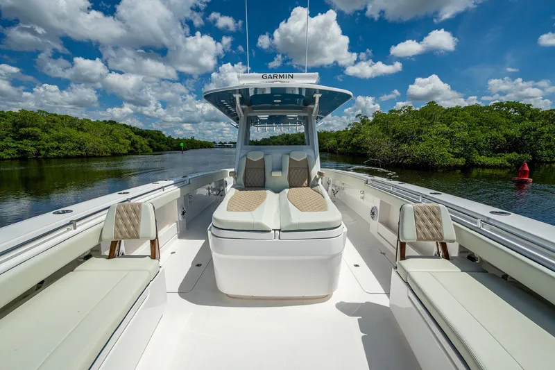 Slide: The Image of 2025 Invincible 37 Catamaran on calm water, featuring luxurious seating and modern design. - 20