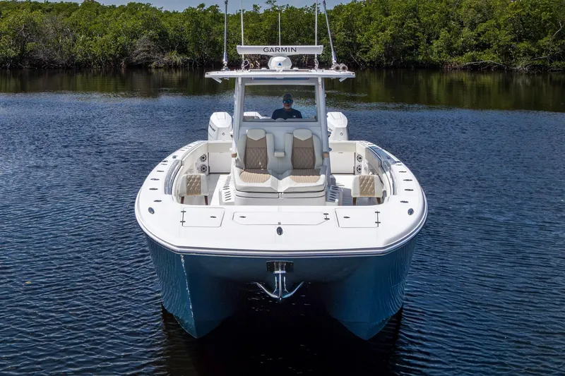 Slide: The Image of 2025 Invincible 37 Catamaran on calm water, showcasing sleek design and advanced features. - 6