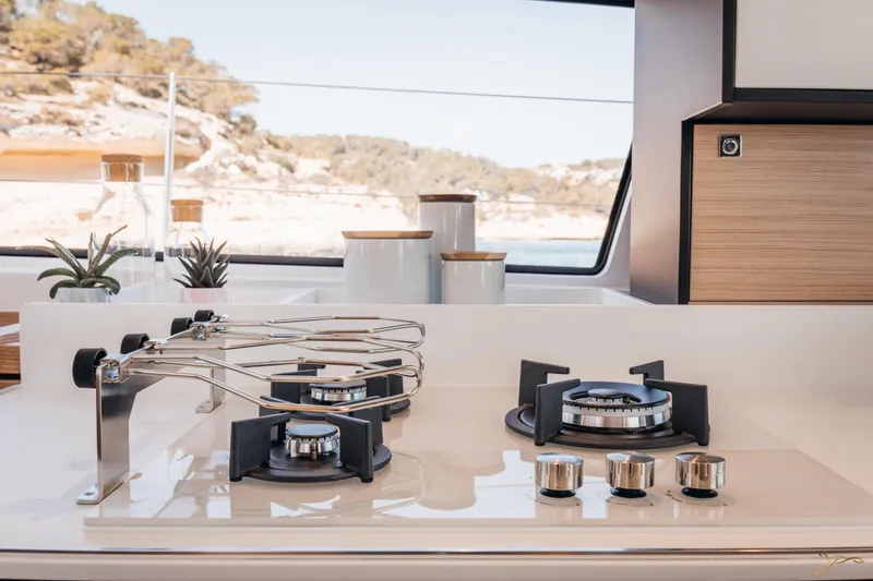 Slide: The Image of Modern kitchen on 2025 Nautitech 44 Open yacht with sleek stove and scenic view. - 38