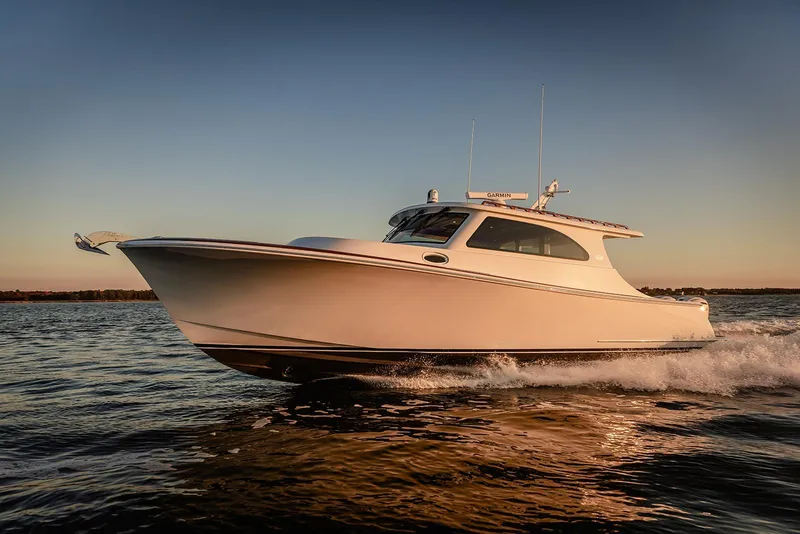 The Image of Composite Yacht CY39 2027 cruising on water at sunset, showcasing sleek design. - 1
