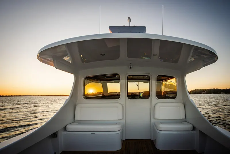 Slide: The Image of 2027 Composite Yacht CY39 at sunset, featuring sleek design and comfortable seating. - 11