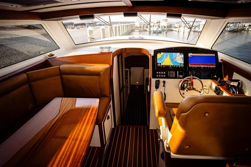 Slide: The Image of Luxurious interior of 2027 Composite Yacht CY39 with navigation screens and leather seating. - 15