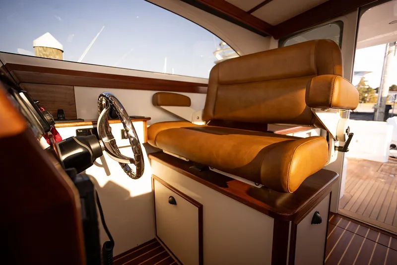 Slide: The Image of Luxurious interior of 2027 Composite Yacht CY39 with leather seating and polished steering wheel. - 17