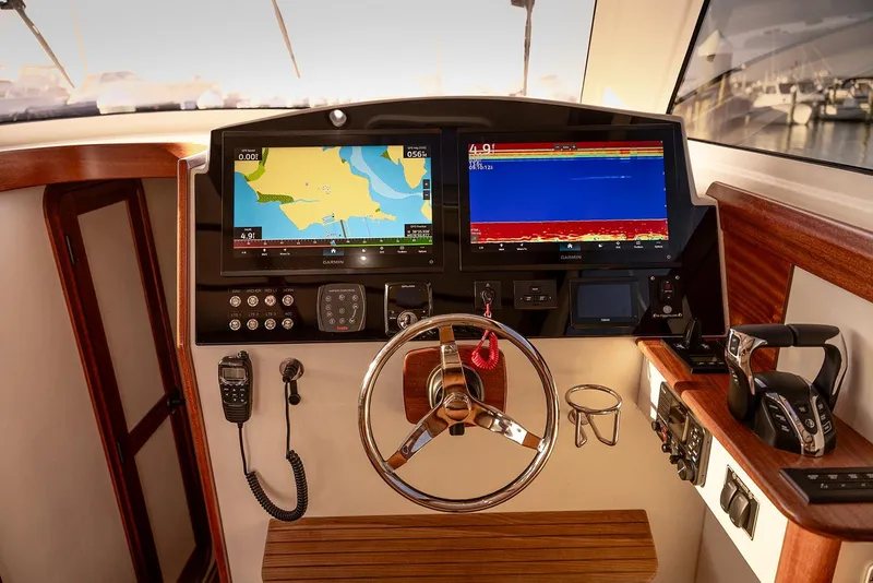 Slide: The Image of Cockpit of 2027 Composite Yacht CY39 with navigation screens and controls. - 18