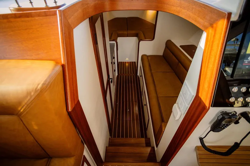 Slide: The Image of Luxurious interior of 2027 Composite Yacht CY39, featuring elegant wood finishes and comfortable seating. - 22