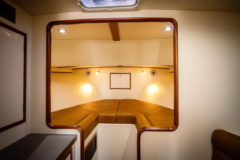 Slide: The Image of Interior cabin of 2027 Composite Yacht CY39, featuring cozy lighting and elegant wood trim. - 23