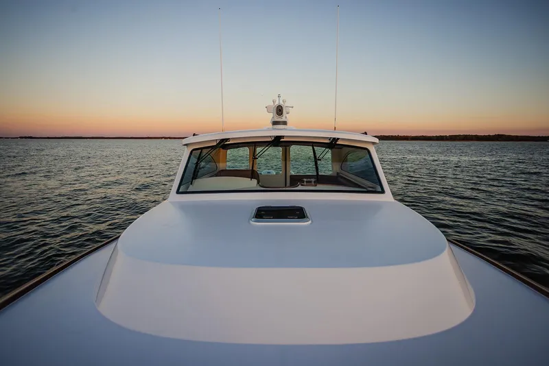 Slide: The Image of Front view of 2027 Composite Yacht CY39 on calm water at sunset. - 5