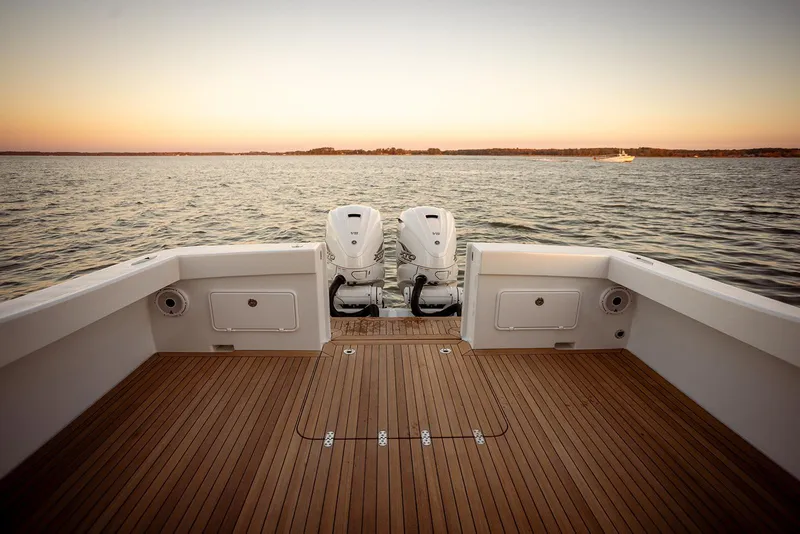 Slide: The Image of Sleek Composite Yacht CY39 deck with dual engines, sunset view, 2027 model. - 7