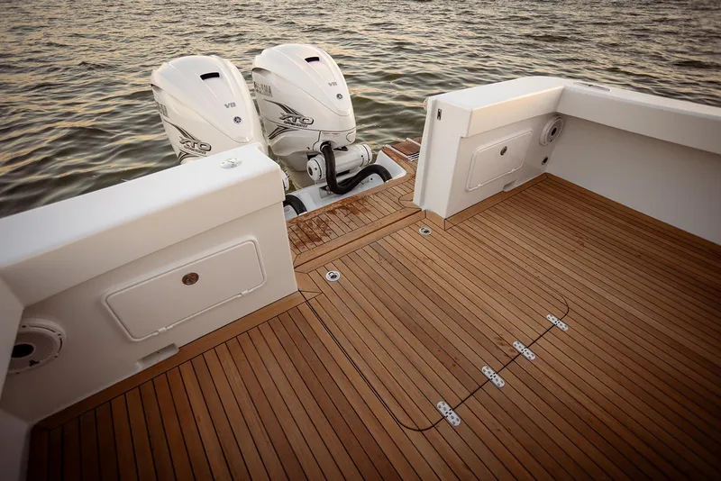 Slide: The Image of Sleek Composite Yacht CY39 deck with dual outboard motors, 2027 model. - 8